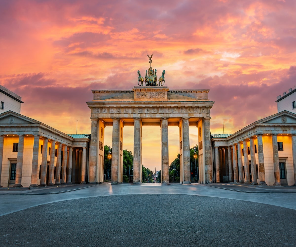 Brandenburg gate illuminated at sunset in Berlin, Germany
